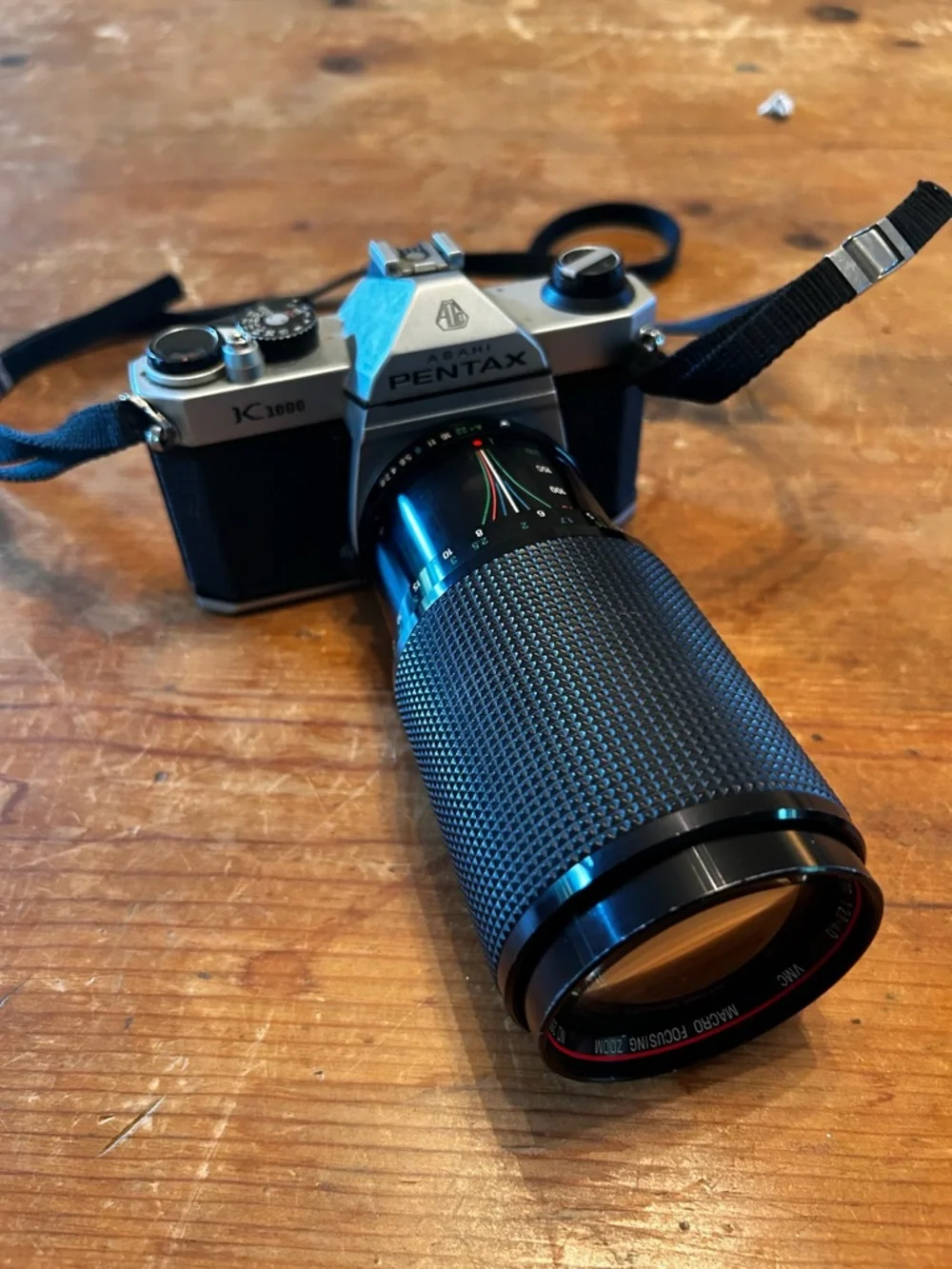 Asahi PENTAX K1000 SLR 35mm camera and Vivitar Series 1 macro-focusing zoom.